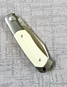 Viper Hug..Sacha Thiel Collab...Ivory G10..M390..4" closed...bolsters and caps w/tube...Leather slip