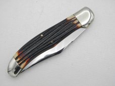 Queen Cutlery #44 Folding Hunter with “burnt orange” imitation Winterbottom bone:  5 1/4” closed, 