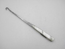 Howard Cutlery Company, circa 1895, button hook with small blade, 5 3/8” overall closed