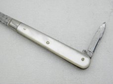 Howard Cutlery Company, circa 1895, button hook with small blade, 5 3/8” overall closed