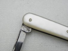 Howard Cutlery Company, circa 1895, button hook with small blade, 5 3/8” overall closed