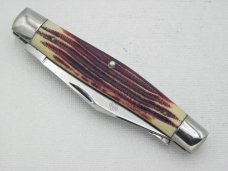 Queen Cutlery #52 Moose in Burnt Orange imitation Winterbottom bone:  4 3/8” closed, circa 1960