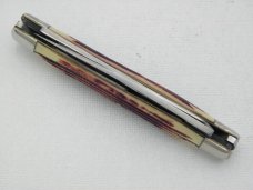 Queen Cutlery #52 Moose in Burnt Orange imitation Winterbottom bone:  4 3/8” closed, circa 1960