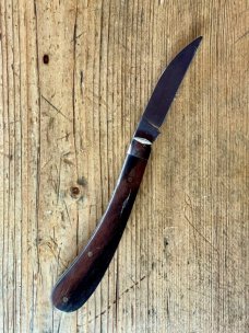 A Wright & Son "Ettrick" Carving Knife with Ebony Scales and Curved Wharncliffe Blade