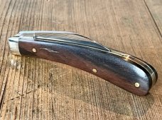 A Wright & Son "Ettrick" Carving Knife with Ebony Scales and Curved Wharncliffe Blade