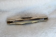 this is a nice 4-inch 2 blade genuine stag horn handle 79-83 