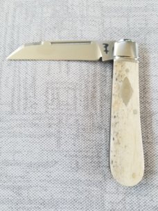 Riaan Ras  Swayback Native..Giraffe Bone..N690..red G10 accents..4" clsd..long pull..coa...SALE