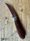 A Wright & Son "Peach" Swayback Knife with Ebony Scales and Curved Wharncliffe Blade