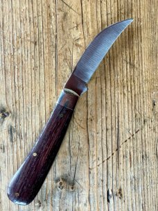 A Wright & Son "Peach" Swayback Knife with Ebony Scales and Curved Wharncliffe Blade