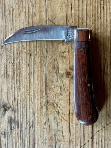 A Wright & Son "Peach" Swayback Knife with Ebony Scales and Curved Wharncliffe Blade