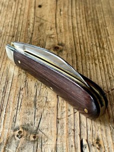 A Wright & Son "Peach" Swayback Knife with Ebony Scales and Curved Wharncliffe Blade