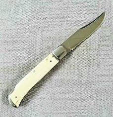 D.R.,David, Davis Mammoth ivory Slimline Lockback,little over 4.".52100..fluted...vine filework 