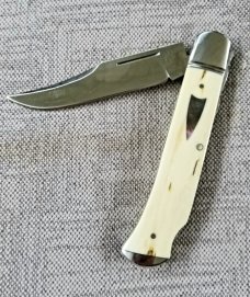 D.R.,David, Davis Mammoth ivory Slimline Lockback,little over 4.".52100..fluted...vine filework 