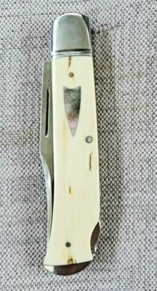 D.R.,David, Davis Mammoth ivory Slimline Lockback,little over 4.".52100..fluted...vine filework 