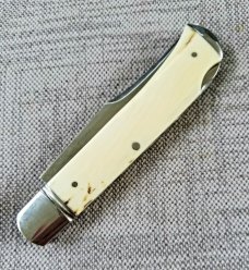 D.R.,David, Davis Mammoth ivory Slimline Lockback,little over 4.".52100..fluted...vine filework 