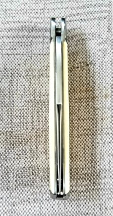 D.R.,David, Davis Mammoth ivory Slimline Lockback,little over 4.".52100..fluted...vine filework 