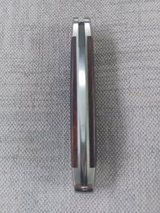 John Travers out of the UK, "Fremont Jack"..Saber ground Sandvik 14C28N with Desert Ironwood, slip