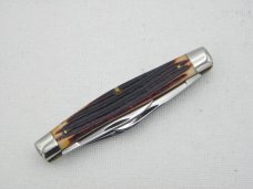 Queen Cutlery #16 Stockman, circa 1960, 3 3/8” closed, burnt orange imitation Winterbottom bone 