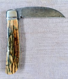 David R. Davis Mammoth ivory Damascus Swayback,closed 4.25" ..fluted...vine filework..MOP shield 