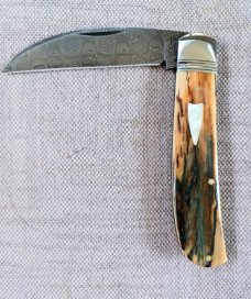 David R. Davis Mammoth ivory Damascus Swayback,closed 4.25" ..fluted...vine filework..MOP shield 