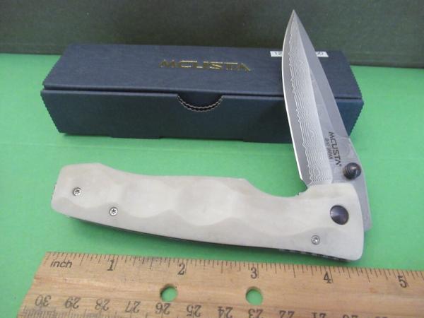Mcusta Elite Series Liner Lock White  Corian  Model # MC-0126D