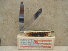 Case XX Amber Bone Peach Seed Jigged Trapper  CV Blades   New In Box 