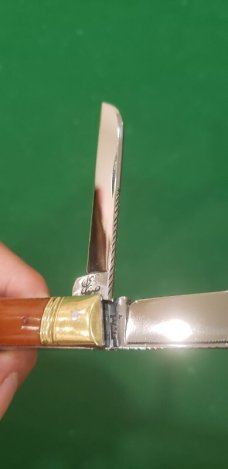 4 1/8" Custom Made Bird's Head Bolster Trapper, Amber Handled with nice file work