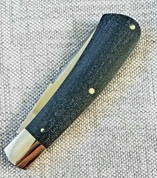 Kabisch Drop Point Trapper. Dark blue Denim Micarta and 01 tool steel...3.75" closed. Stunning piece