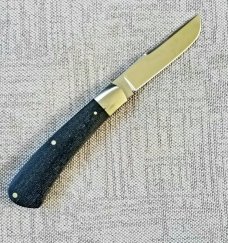 Kabisch Drop Point Trapper. Dark blue Denim Micarta and 01 tool steel...3.75" closed. Stunning piece