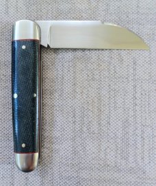K'roo Wharnie Sleeveboard,3.75"cld..Rwl34 long pull..Denim micarta and red accents..Arrowhead Shield