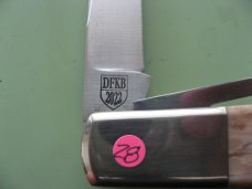 DANIELS FAMILY KNIFE BRANDS-NAPANOCH KNIFE CO.-NORTH AMERICAN GAME WARDEN MAMMOTH IVORY