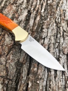 BUCK 113 CUSTOM LEROY REMER ORANGE JIGGED SKNNER
