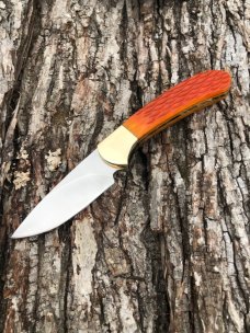 BUCK 113 CUSTOM LEROY REMER ORANGE JIGGED SKNNER