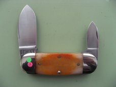 DANIELS FAMILY KNIFE BRANDS-TITUSVILLE CUTLERY-MOTHER HUBBARD SUNFISH-SAW CUT AMBER BONE
