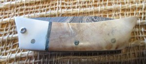 Handmade, unsigned, Damascus folding knife with burl and off-white handle 