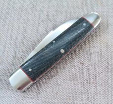 K'roo Wharnie Sleeveboard,3.75"cld..Rwl34 long pull..Denim micarta and red accents..Arrowhead Shield