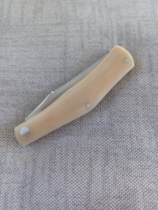 Rhidian Rogue Wave Trapper...Bone Linen micarta. .Cpm154..3.625 cld..red liners..Shield.. slip