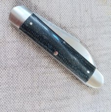 K'roo Wharnie Sleeveboard,3.75"cld..N690 long pull..Denim micarta and Arrowhead Shield..coa&slip