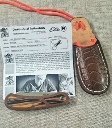 Johan Ellis Lion 4",Birch Burl inlays and Natural Micarta Frame over G10 and titanium..Rwl34..coa 