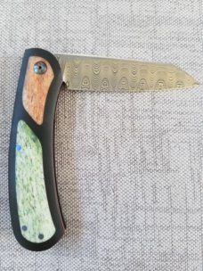 Johan Ellis Lion 4",Damasteel with Giraffe Bone inlays and Paper Micarta Frame over G10 and titanium