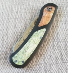 Johan Ellis Lion 4",Damasteel with Giraffe Bone inlays and Paper Micarta Frame over G10 and titanium