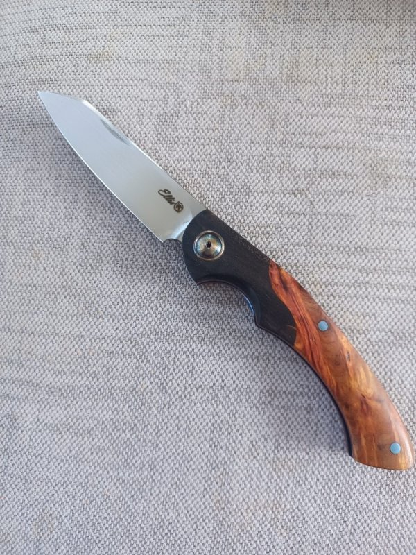 Johan Ellis Springbok...4",Karilian Scales & splated Bolsters...G10 and titanium frame.Rwl34..coa 