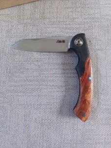 Johan Ellis Springbok...4",Karilian Scales & splated Bolsters...G10 and titanium frame.Rwl34..coa 
