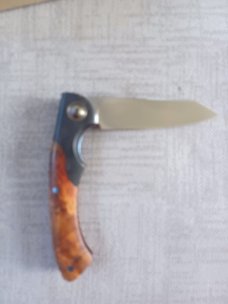 Johan Ellis Springbok...4",Karilian Scales & splated Bolsters...G10 and titanium frame.Rwl34..coa 