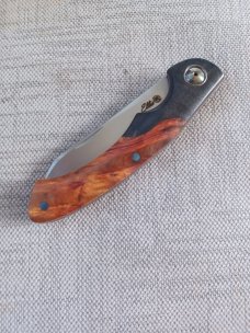 Johan Ellis Springbok...4",Karilian Scales & splated Bolsters...G10 and titanium frame.Rwl34..coa 