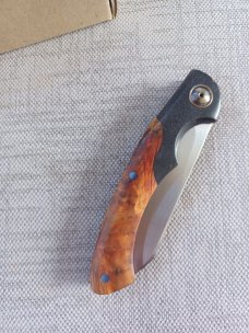 Johan Ellis Springbok...4",Karilian Scales & splated Bolsters...G10 and titanium frame.Rwl34..coa 