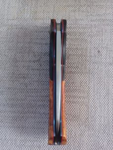 Johan Ellis Springbok...4",Karilian Scales & splated Bolsters...G10 and titanium frame.Rwl34..coa 