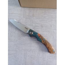 Johan Ellis Springbok...4",Karilian Bolsters..Amboyna scales...G10 and titanium frame.Rwl34..coa
