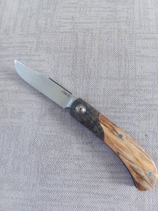Johan Ellis Springbok...4",Karilian Bolsters..Amboyna scales...G10 and titanium frame.Rwl34..coa 