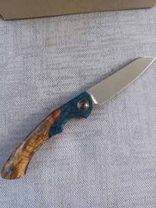 Johan Ellis Springbok...4",Karilian Bolsters..Amboyna scales...G10 and titanium frame.Rwl34..coa 